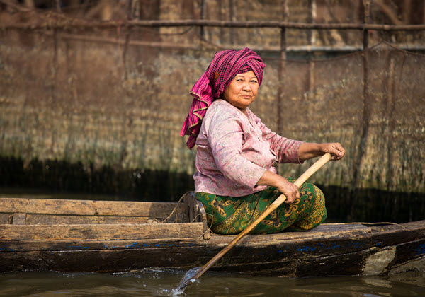 woman on wooden boat